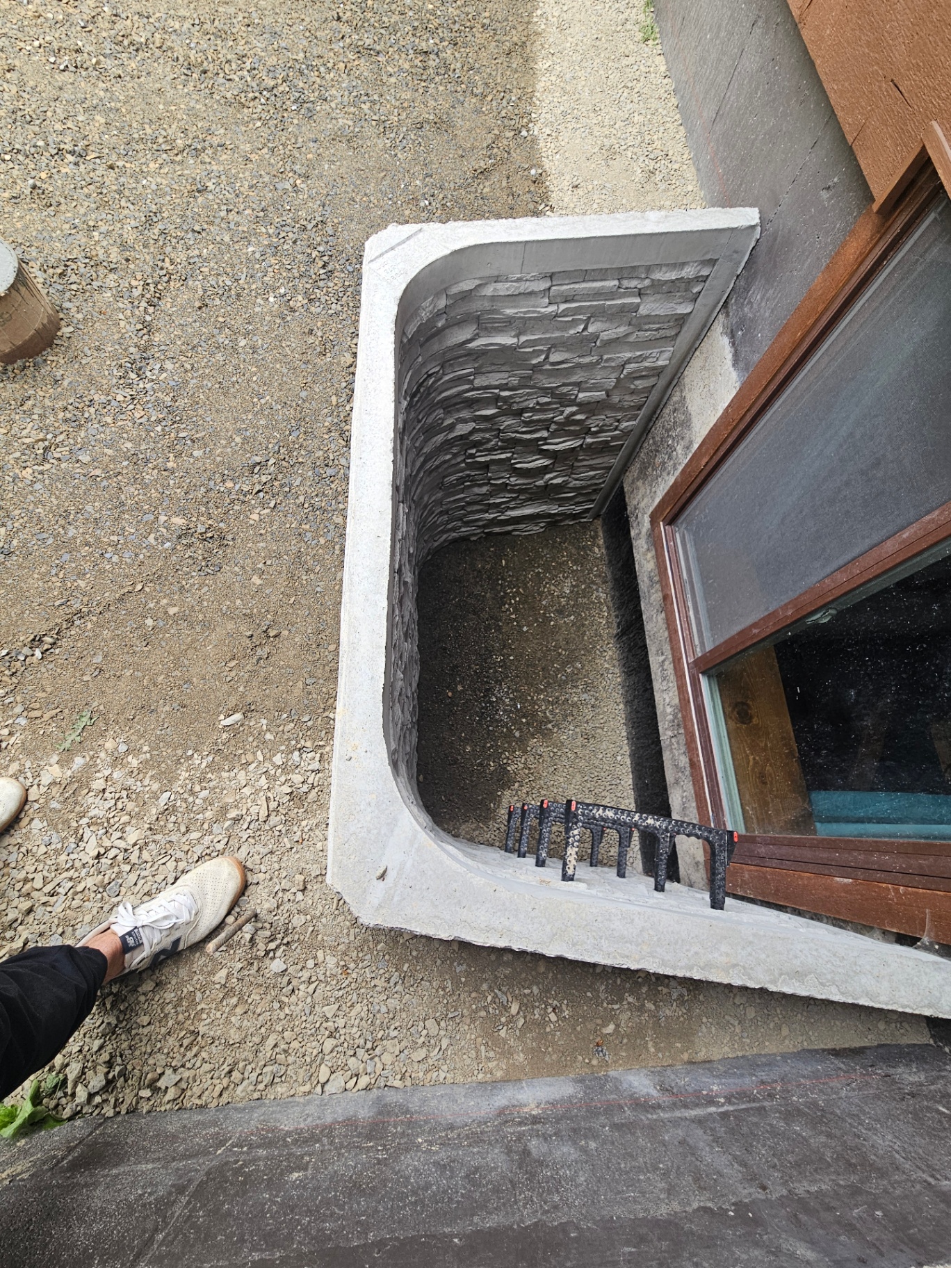 concrete cutting an precast ingress/ egress window well installation